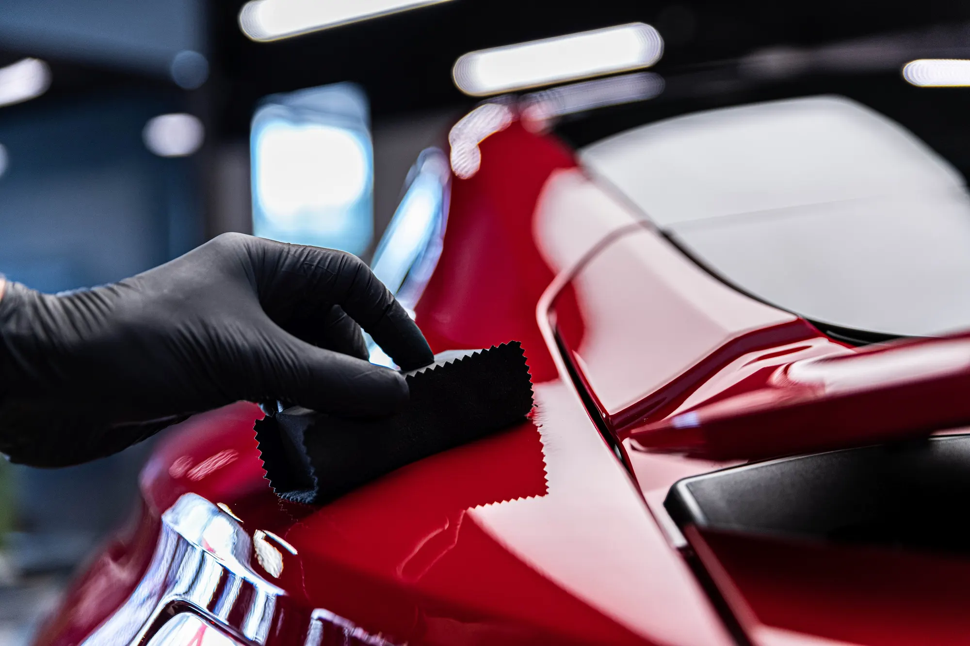 Water beading on ceramic-coated paint showing hydrophobic protection