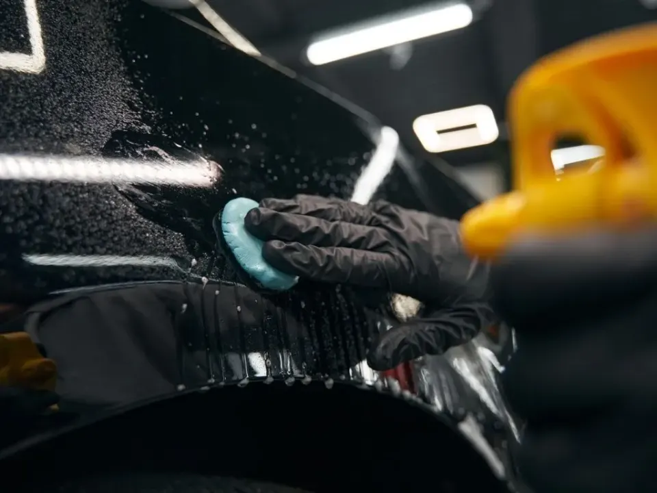 Applying paint sealant for long-lasting protection and gloss on car exterior